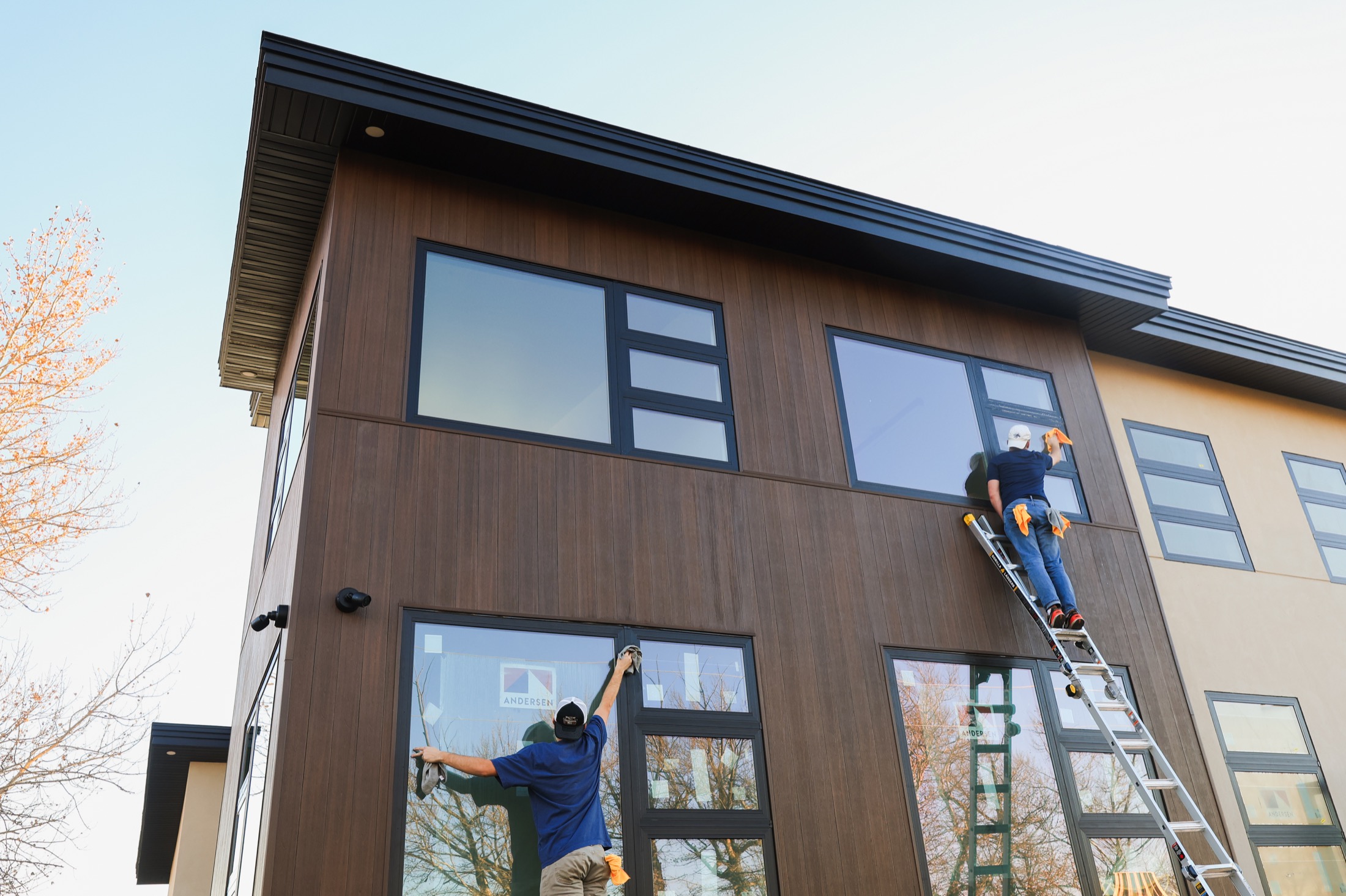 Summit Solutions team cleaning exterior windows on a commercial property